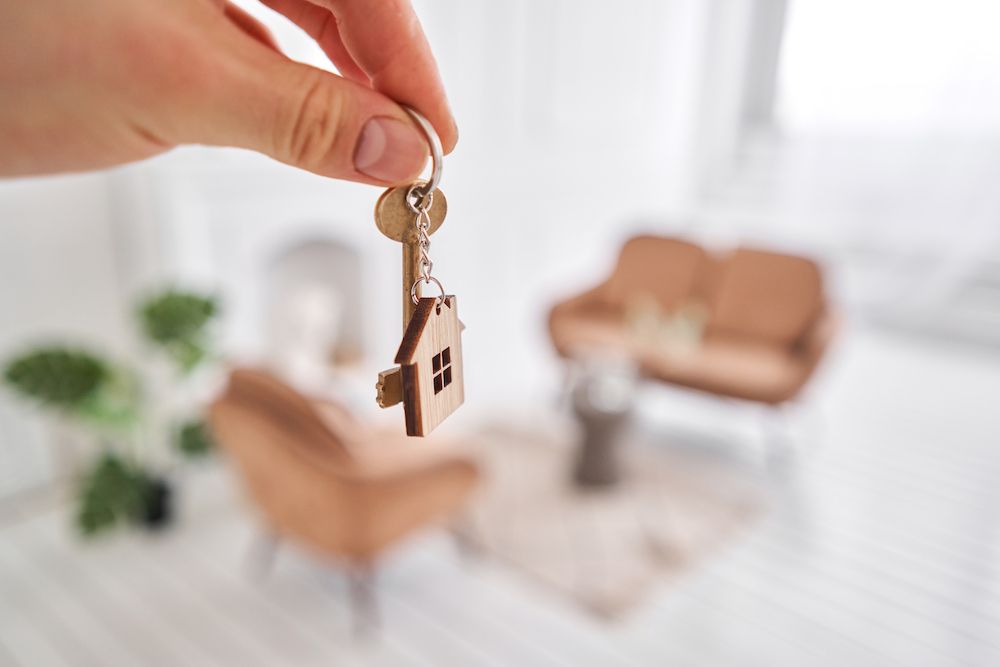 Person holding up house keys