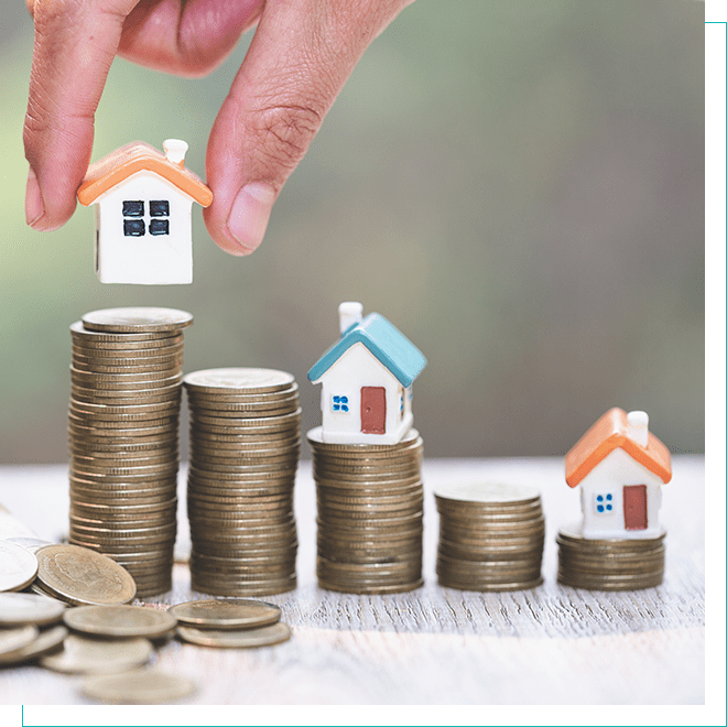 Investment in Colorado Real Estate - Hand Placing Miniature House on Coin Stack Hand placing a miniature house on a stack of coins, symbolizing real estate investment in Colorado