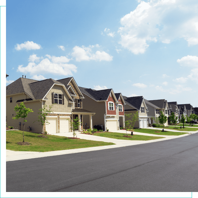 View of neighborhood homes with sidewalk and street in view Street view of residential neighborhood homes
